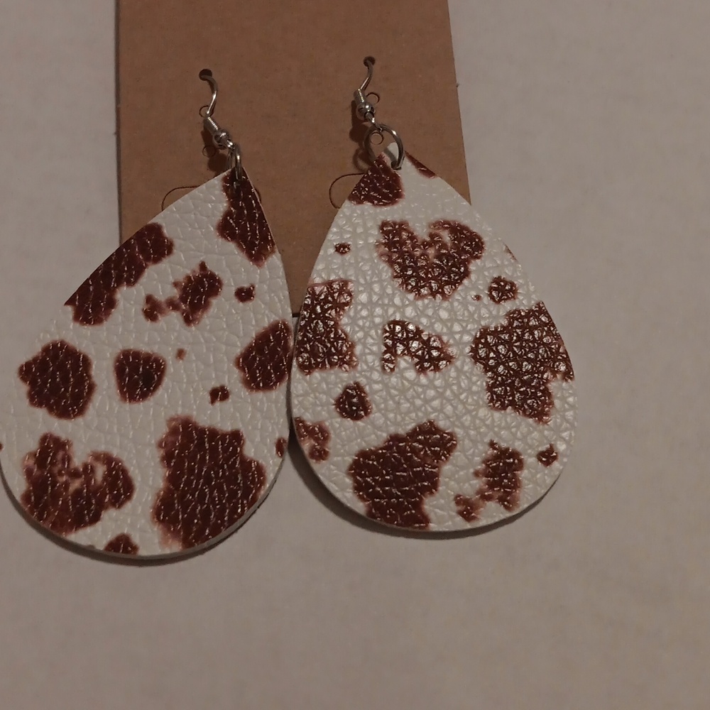 Tan and white cow print earrings